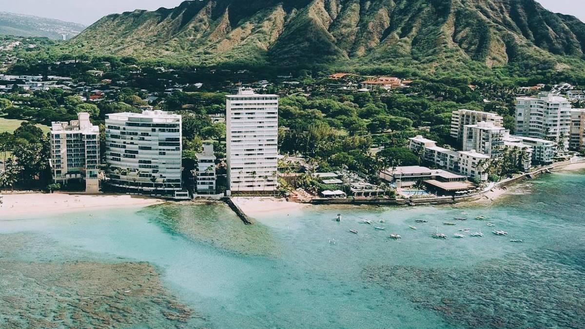 Aerial View of the Pool and Ocean at Outrigger Reef Waikiki Beach Resort - Oahu, Hawaii, USA