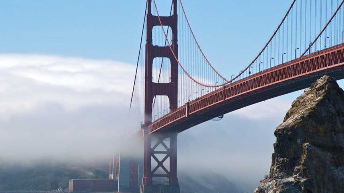 ground view of Golden Gate Bridge with mist and fog from Fort Baker in San Francisco, California, USA