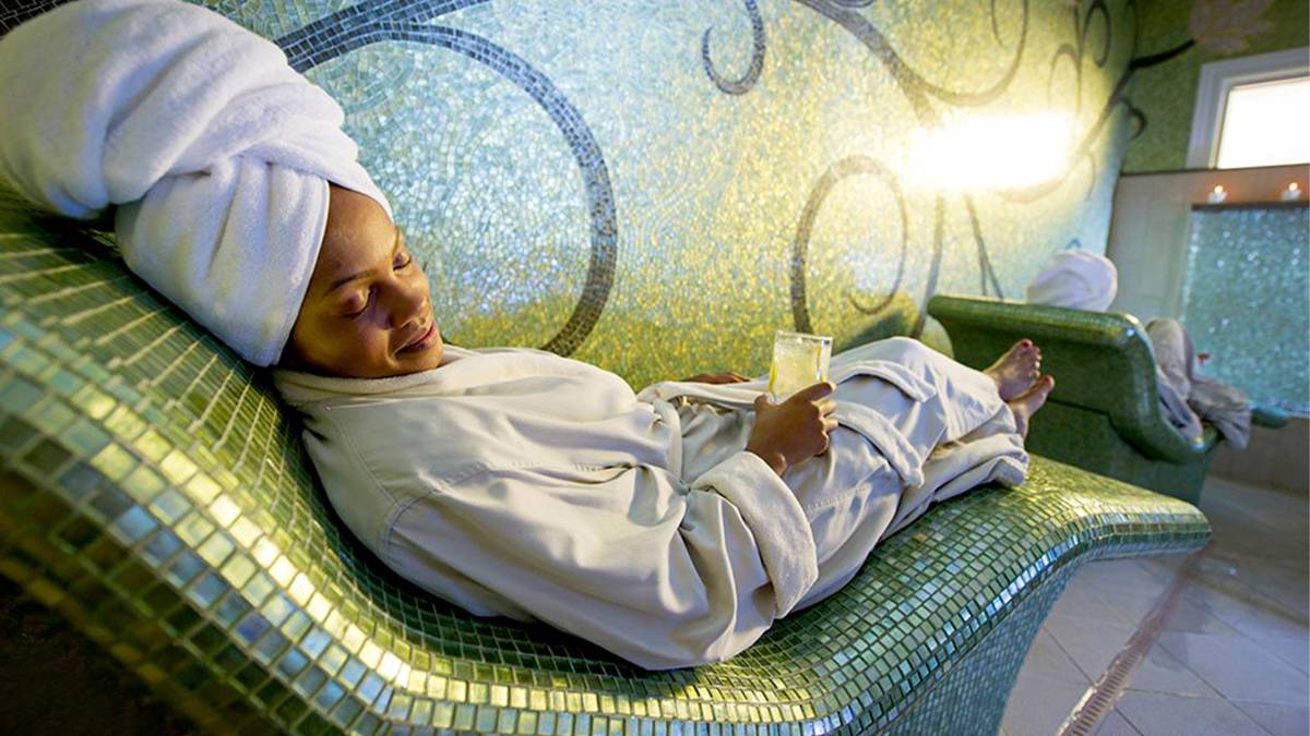 woman resting at the Disney's Grand Floridian Resort & Spa with a glass of water in Orlando, Florida, USA