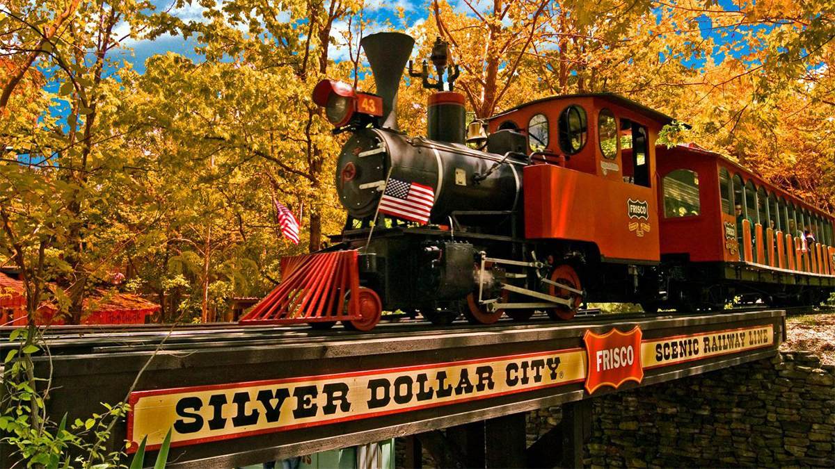 train going across bridge at silver dollar city
