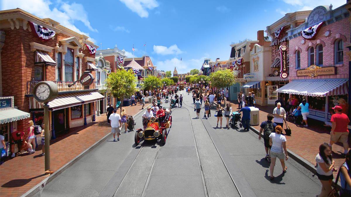 Main Street Disneyland decorated in red, white, and blue banners for the fourth of July celebrations Los Angeles, California, USA