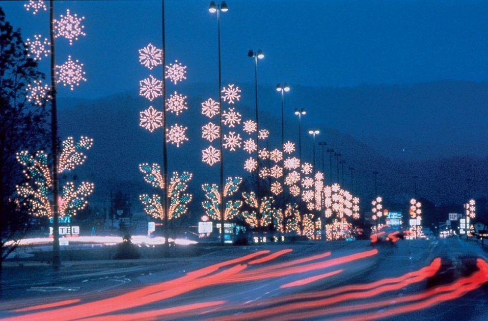 blurred lights and snowflakes on light poles at Smoky Mountain Winterfest Parkway Lights in Pigeon Forge, Tennessee, USA