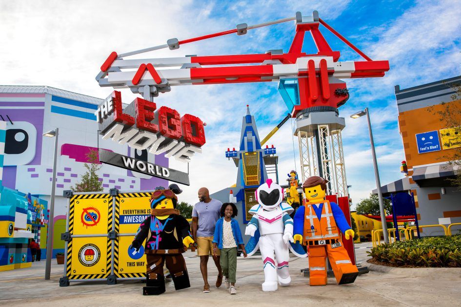 A family walks with LEGO characters in the LEGO Movie World at LEGOLAND California in Carlsbad, CA, USA