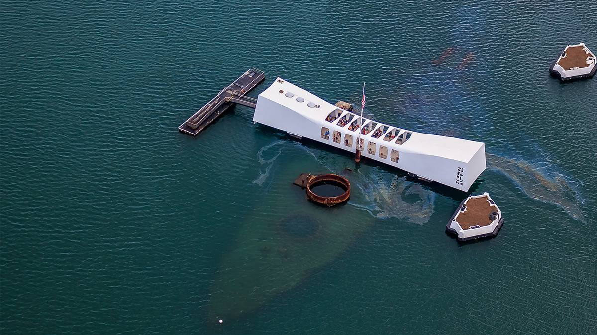 View looking down on Pearl Harbor during the day and there appears to be some oil in the water in Oahu Hawaii