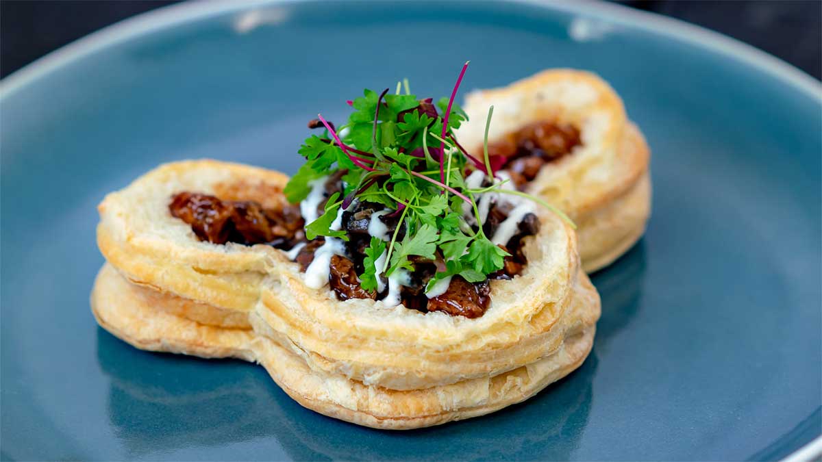 Close up photo of Reimagined Beef Brisket Wellington at Disneyland California Adventure Food and Wine Festival in Anaheim, California, USA