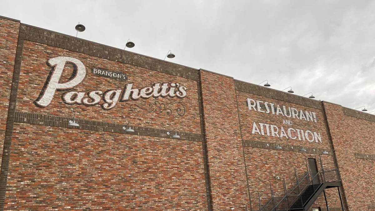 Looking up at the brick wall outside of Pasghetti's Restaurant and Attraction in Branson, Missouri, USA