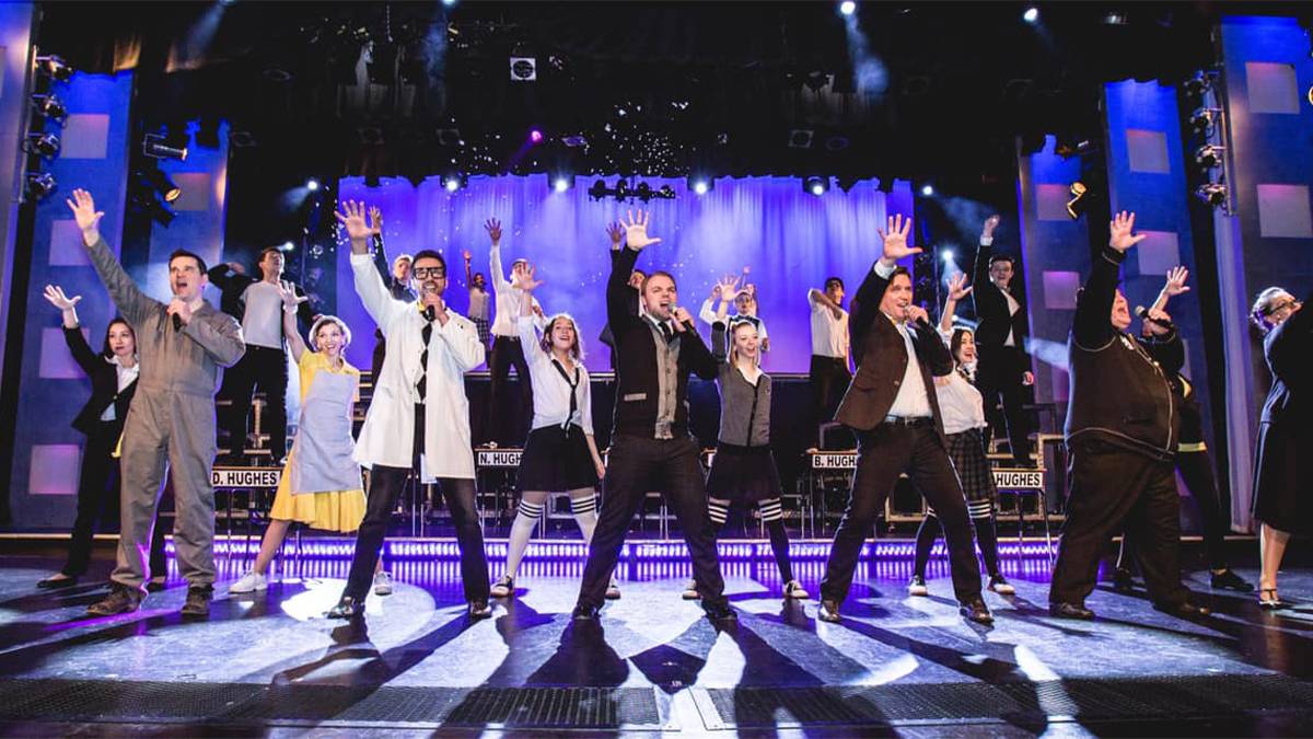 Show of performers on stage on singing at the Hughes Brothers Theatre in Branson, Missouri, USA