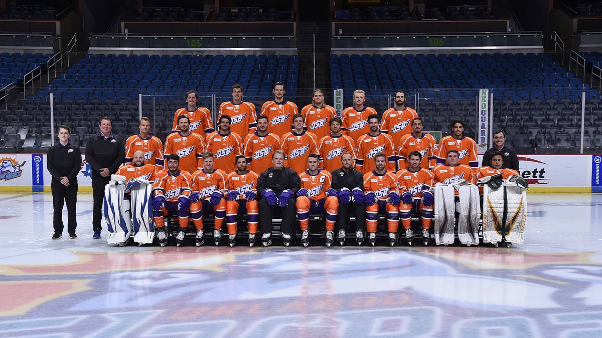 Team photo of the Orlando Solar Bears wearing their orange uniform on the ice in Orlando, Florida, USA