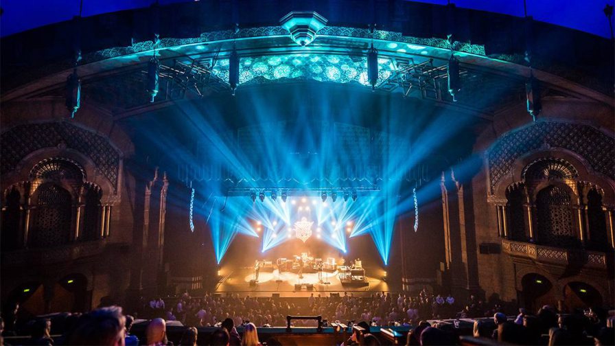Wide shot of a concert with blue and a yellow lighting at The Fox Theater in Atlanta, Georgia, USA