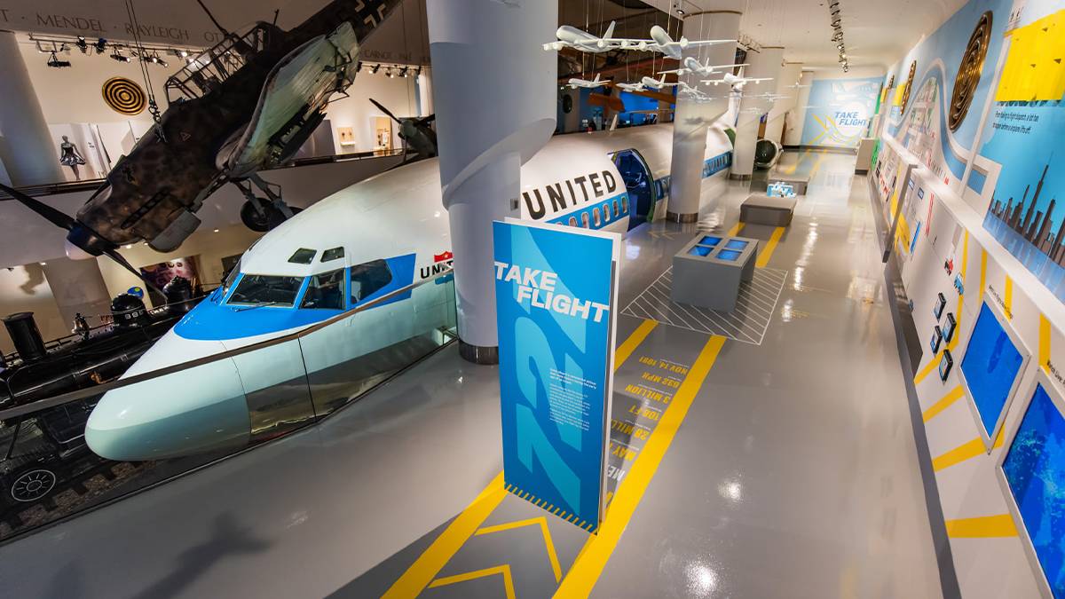 Looking over the Take Flight exhibit that houses a United plane and the Interactive Flight Simulator at the Museum of Science and Industry in Chicago, Illinois, USA