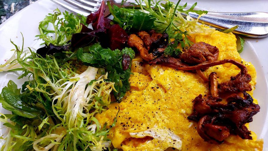 Close up photo of a breakfast of gourmet eggs and veggies from Zuni Café in San Francisco, California, USA