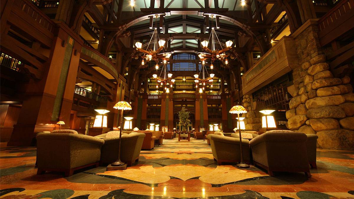 lobby of the Disney Grand Californian Hotel and Spa decorated with chandeliers, lamps, and sofas located at Disneyland, Anaheim, California, USA
