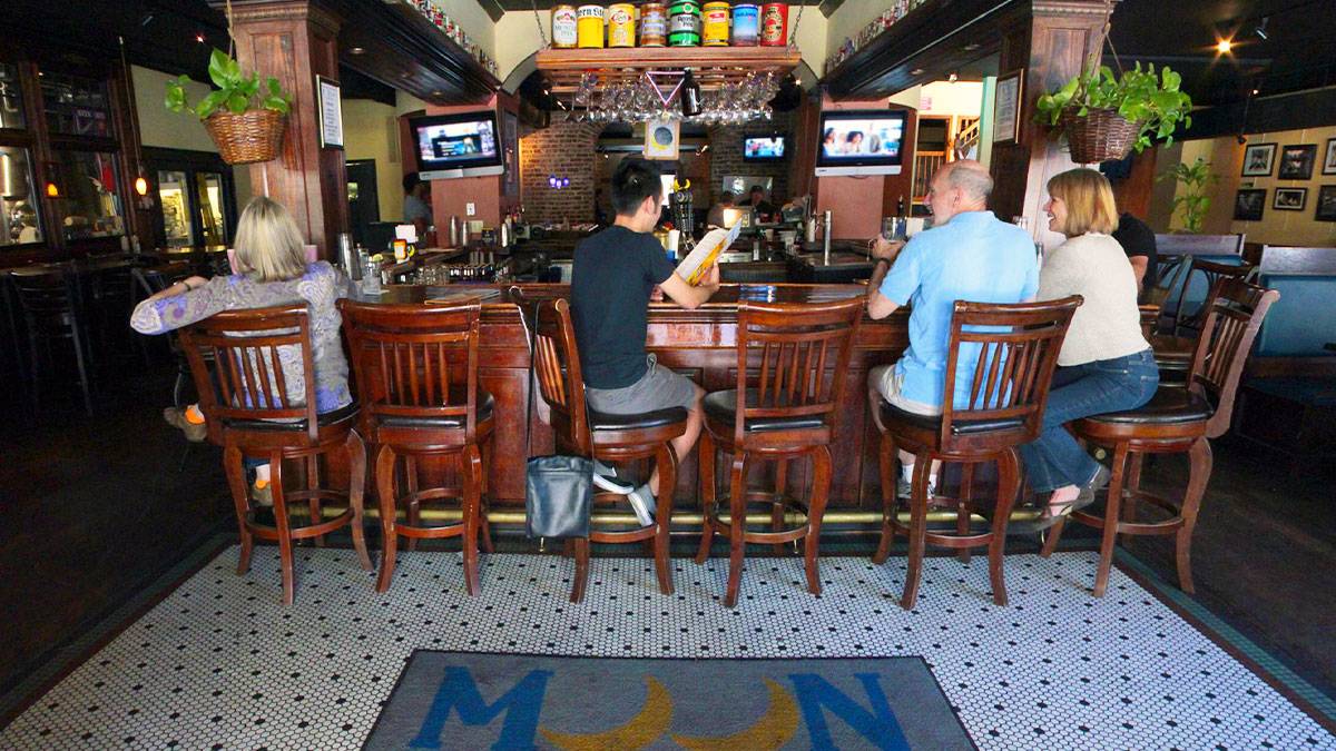 people sitting at the bar at Moon River Brewing Co.