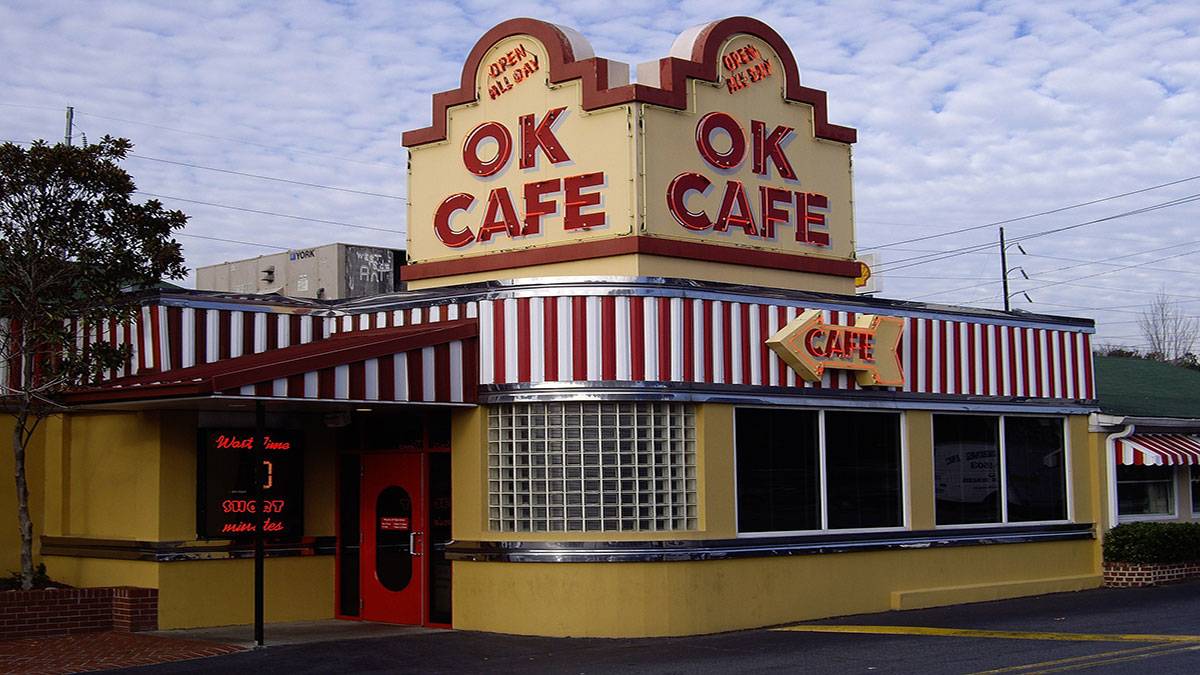 exterior of Buckhead's Ok Cafe with neon signs during a cloudy day at Atlanta, Georgia, USA