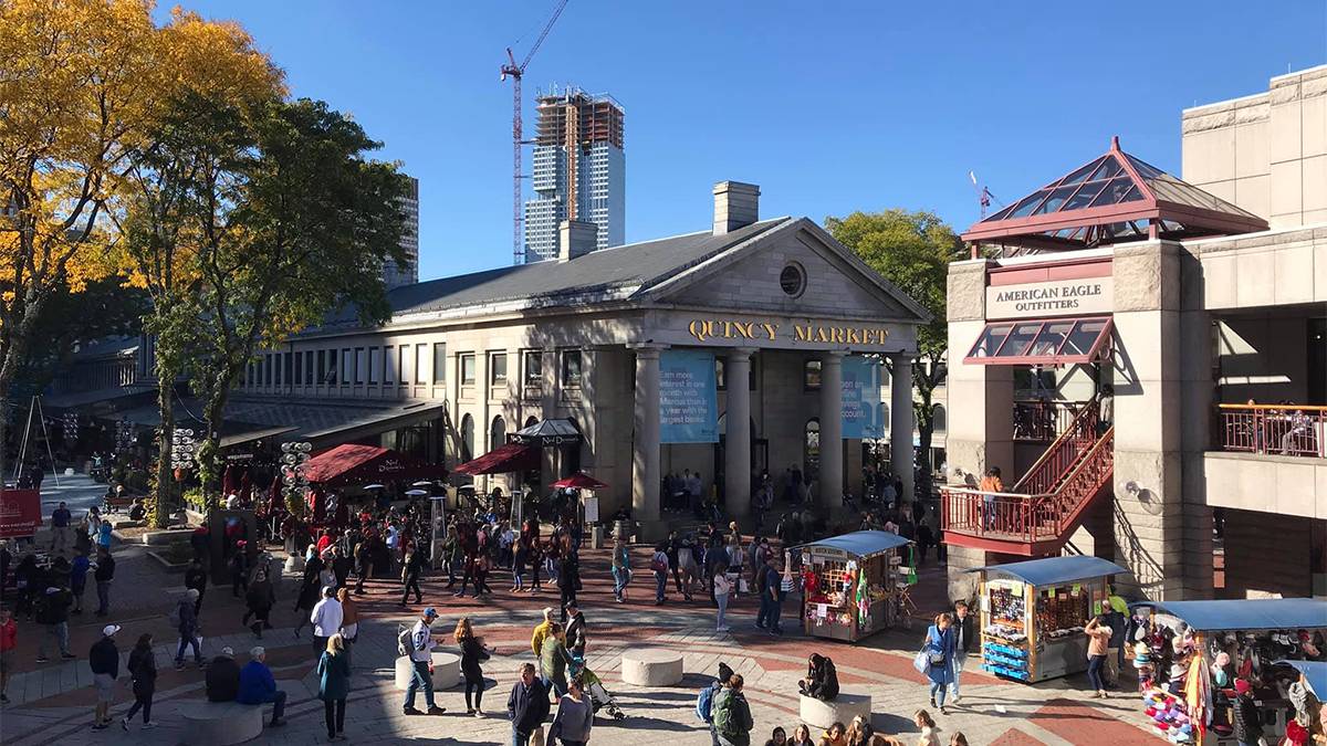 View looking down over Quincy Market on a busy sunny day in Boston, Massachusetts, USA
