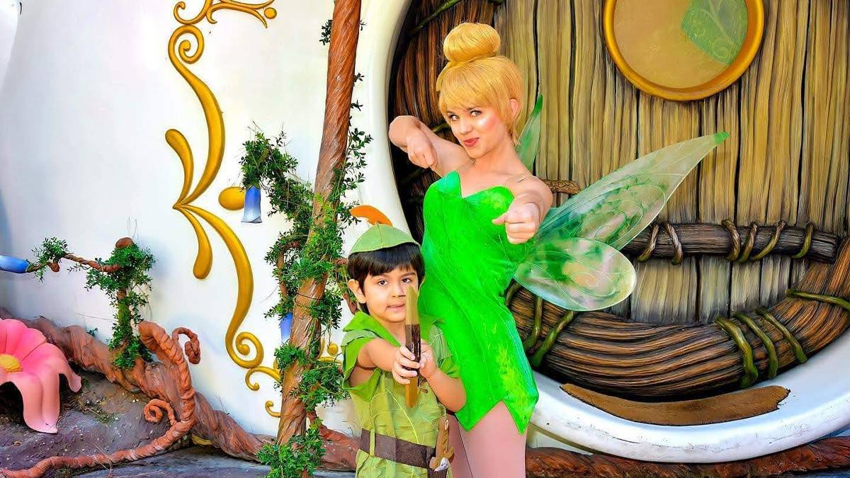 Close up of Tinkerbell and a young boy dressed as a Lost Boy at a Meet and Great at Walt Disney World in Orlando, Florida, USA