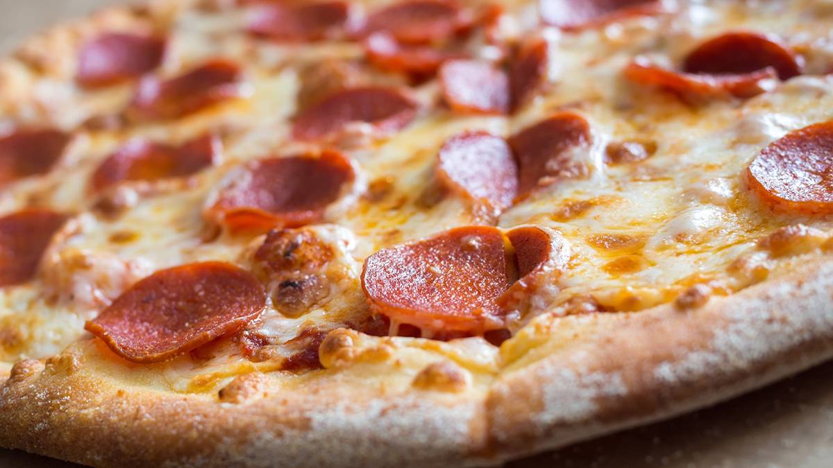 Close up of a cheesy pepperoni pizza
