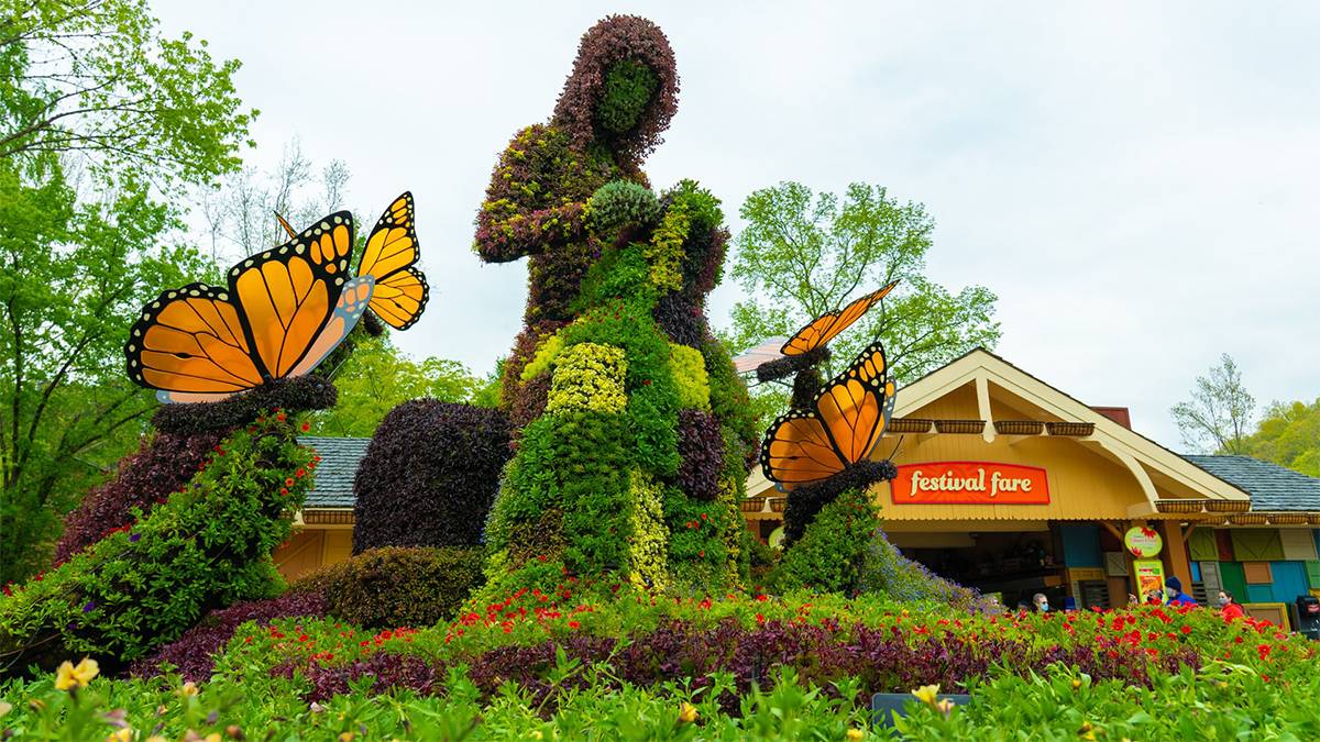 Close up of the center piece for the Flower and Food festival, a topiary of a women and butterflies around her, at Dollywood in Pigeon Forge, Tennessee, USA